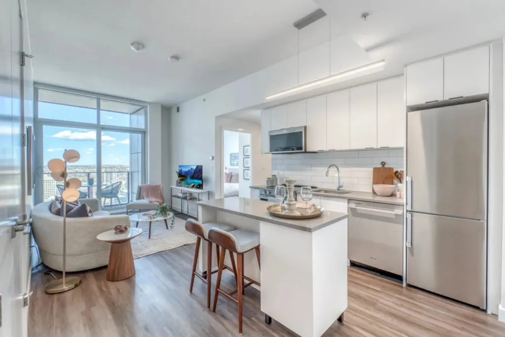 Full kitchen in a Corporate Stays furnished apartment Canada
