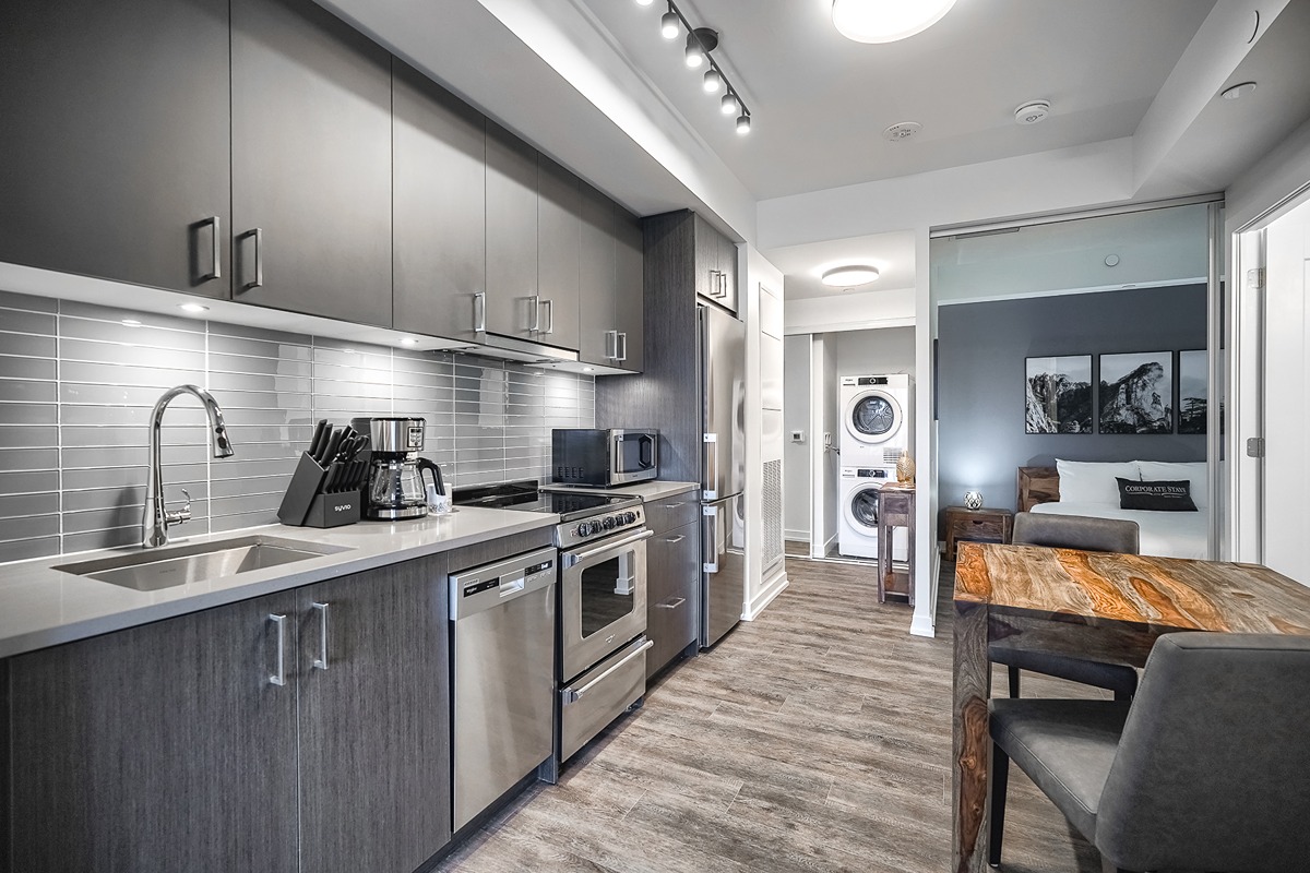 Fully furnished apartment kitchen and living area ready for move-in
